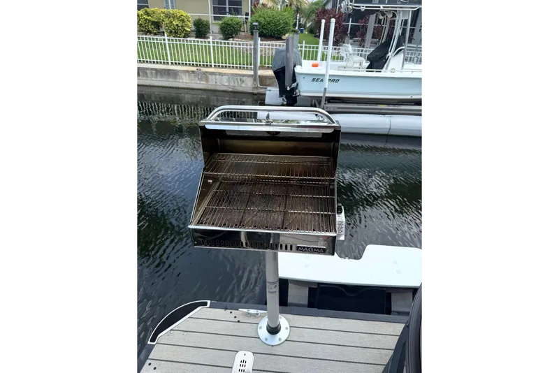 Slide: The Image of Outdoor grill mounted on a dock beside a Starcraft SLS 3 boat, 2021 model. - 51