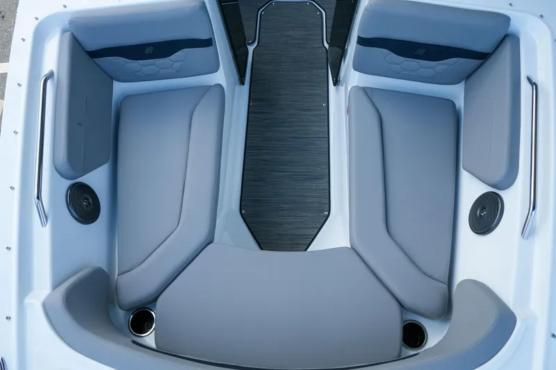 Slide: The Image of Interior seating of 2027 Four Winns HD2 OB boat, featuring gray upholstery and cup holders. - 22