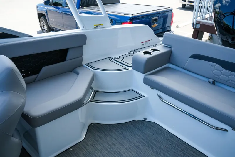 Slide: The Image of Interior of 2027 Four Winns HD2 OB boat with gray seating and cup holders. - 30