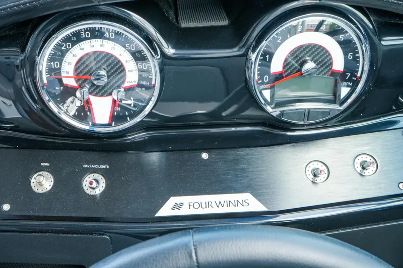 Slide: The Image of Dashboard of 2027 Four Winns HD2 OB boat with speedometer and controls. - 17