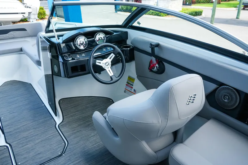 Slide: The Image of Interior of 2027 Four Winns HD2 OB boat with modern dashboard and seating. - 14