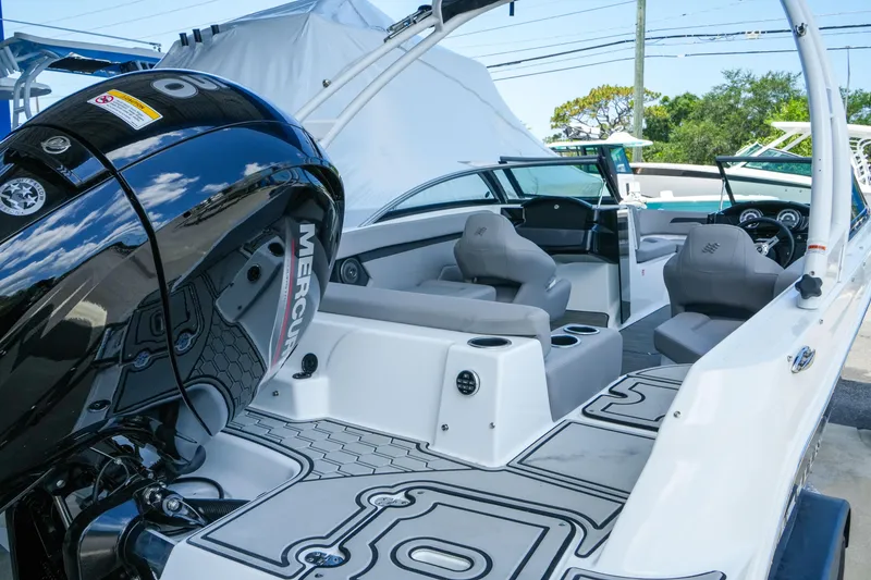 Slide: The Image of 2027 Four Winns HD2 OB boat interior with Mercury outboard engine, featuring sleek seating and modern design. - 5