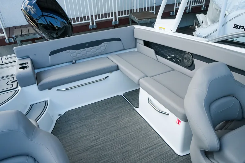 Slide: The Image of 2027 Four Winns HD2 OB boat interior with gray seating and modern design. - 29