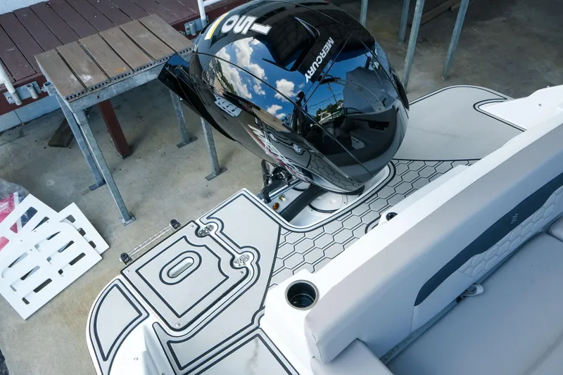 Slide: The Image of 2027 Four Winns HD2 OB boat with Mercury outboard motor, featuring sleek deck design. - 34