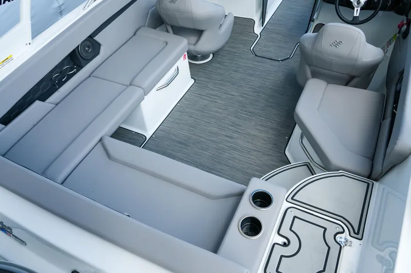 Slide: The Image of 2027 Four Winns HD2 OB boat interior with gray seating and modern design. - 6