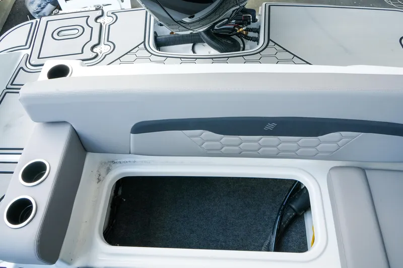 Slide: The Image of Interior view of 2027 Four Winns HD2 OB boat, featuring seating and storage compartment. - 33