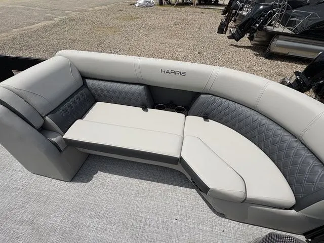 Slide: The Image of The image shows a luxurious seating area on a 2026 Harris Cruiser 230 boat. - 6