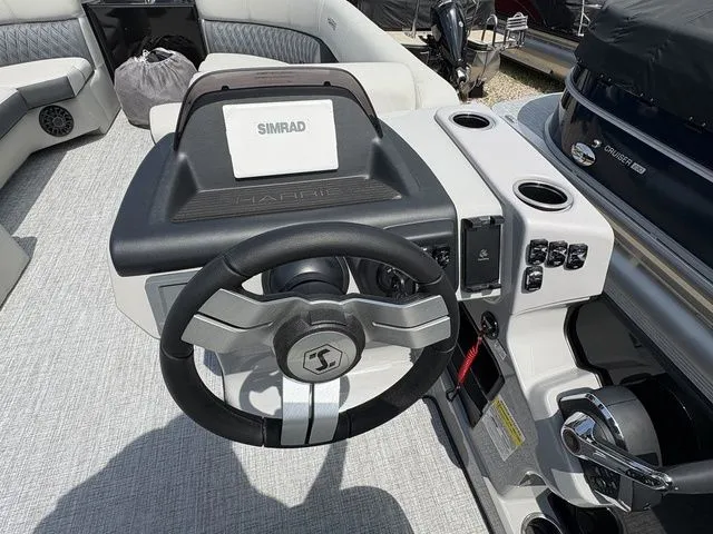 Slide: The Image of The image shows the helm of a 2026 Harris Cruiser 230 with a Simrad display. - 8