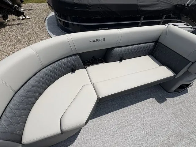 Slide: The Image of The image shows a luxurious seating area on a 2026 Harris Cruiser 230 boat. - 5