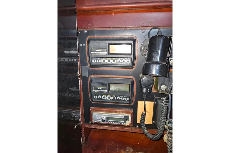 Slide: The Image of Control panel of a 1987 Tayana 52 yacht with communication equipment. - 24