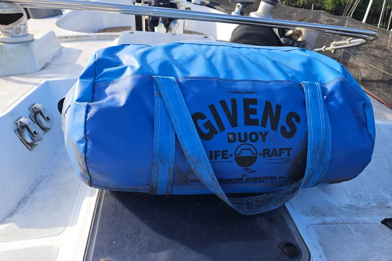 Slide: The Image of Blue Givens buoy life raft bag on 1987 Tayana 52 yacht deck. - 30