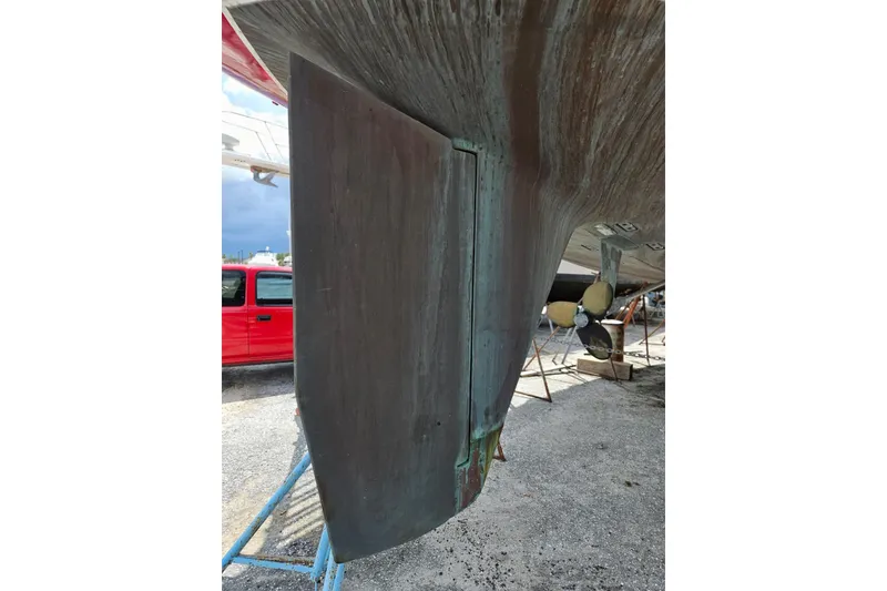 Slide: The Image of 1987 Tayana 52 sailboat rudder and propeller in dry dock. - 39