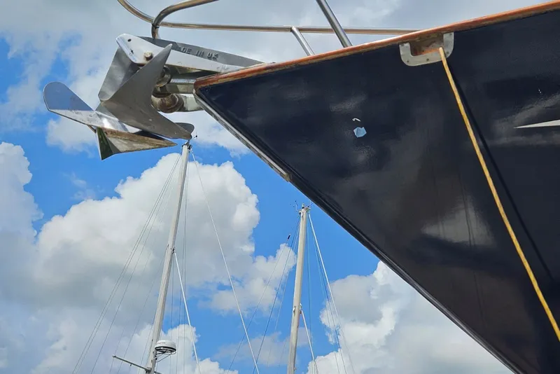 Slide: The Image of Bow of 1987 Tayana 52 sailboat with anchor against cloudy sky. - 33