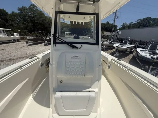 Slide: The Image of 2025 Cobia 265 Open Center Console with spacious deck and modern helm station. - 14