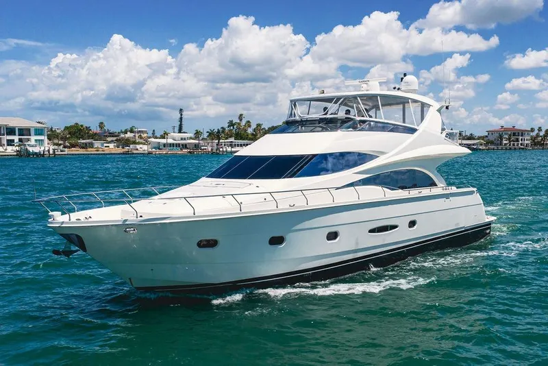 Slide: The Image of Luxurious 2005 Marquis 65 MY yacht cruising on clear blue waters under a sunny sky. - 2