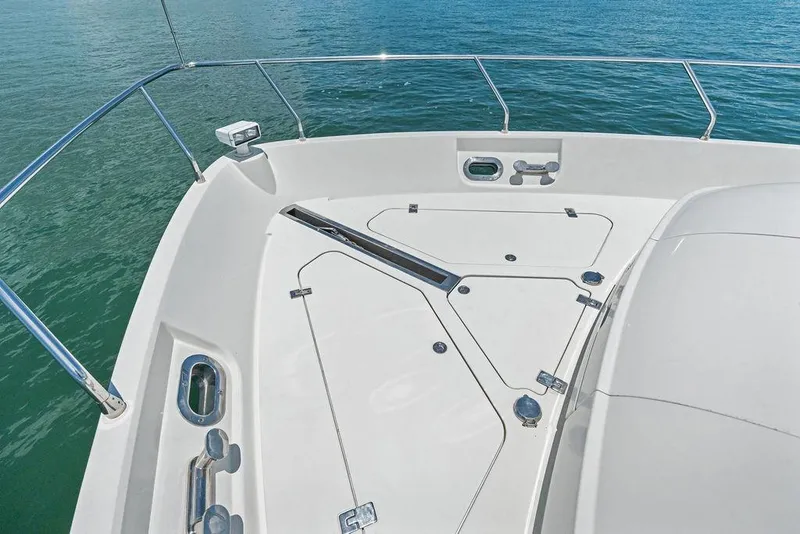 Slide: The Image of Bow deck of 2005 Marquis 65 MY yacht with stainless steel railings and ocean view. - 42