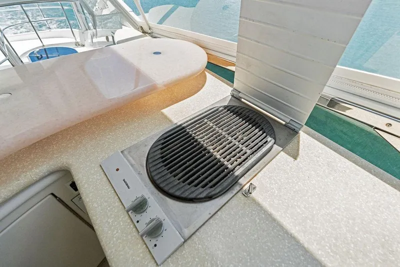 Slide: The Image of Outdoor grill on 2005 Marquis 65 MY yacht, featuring a sleek countertop design. - 56