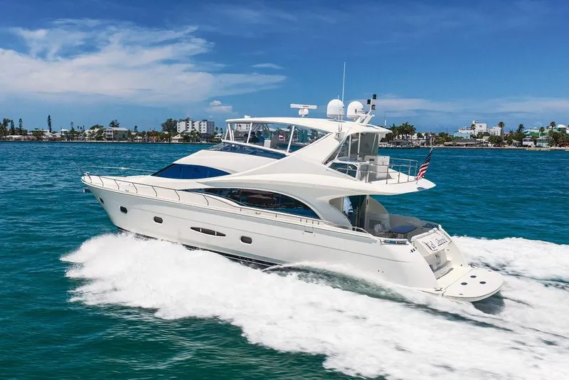 Slide: The Image of Luxurious 2005 Marquis 65 MY yacht cruising on clear blue waters under a sunny sky. - 6