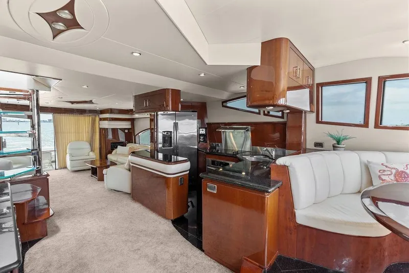 Slide: The Image of Luxurious interior of a 2005 Marquis 65 MY yacht with elegant wood finishes and modern amenities. - 74