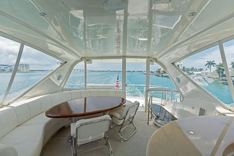 Slide: The Image of Luxurious interior of 2005 Marquis 65 MY yacht with ocean view and elegant seating. - 53