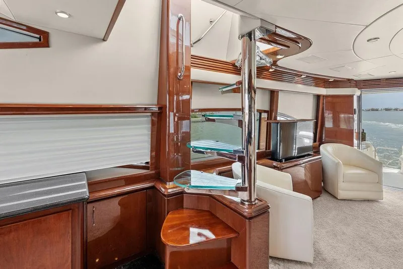 Slide: The Image of Luxurious interior of 2005 Marquis 65 MY yacht with elegant wood finishes and modern furnishings. - 79