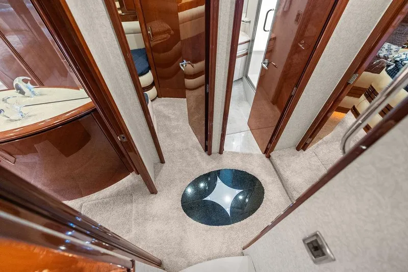 Slide: The Image of Luxurious interior of 2005 Marquis 65 MY yacht with elegant wood finishes and plush carpeting. - 19