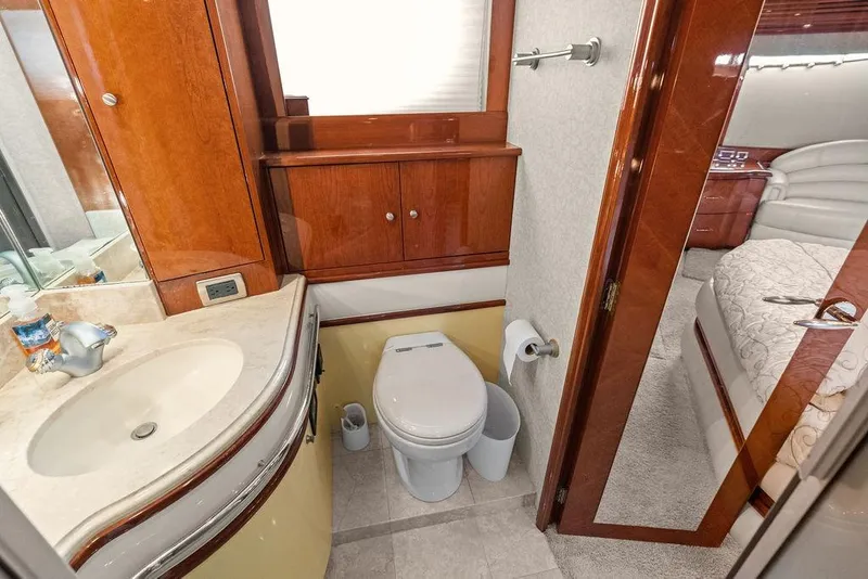 Slide: The Image of Luxurious bathroom in 2005 Marquis 65 MY yacht with elegant wood cabinetry and modern fixtures. - 34