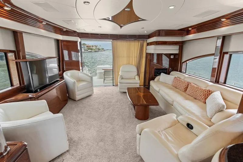 Slide: The Image of Luxurious interior of a 2005 Marquis 65 MY yacht with elegant seating and ocean view. - 68