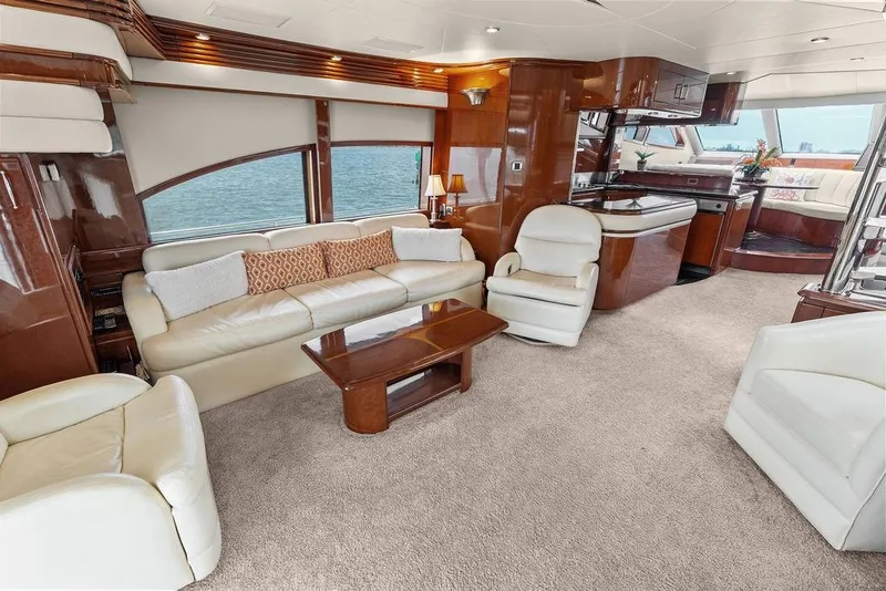 Slide: The Image of Luxurious interior of 2005 Marquis 65 MY yacht with elegant seating and wood finishes. - 66