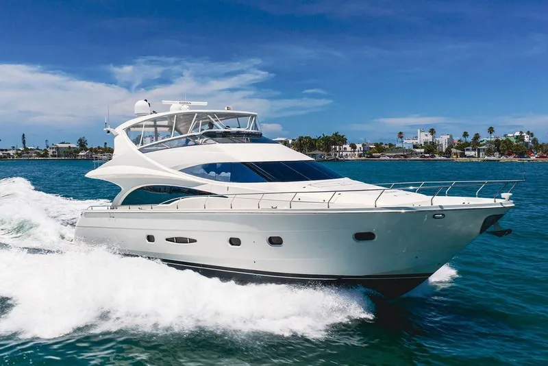 Slide: The Image of Luxurious 2005 Marquis 65 MY yacht cruising on clear blue waters. - 17