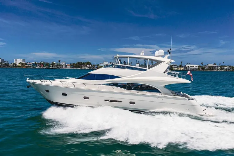 Slide: The Image of Luxurious 2005 Marquis 65 MY yacht cruising on clear blue waters. - 7