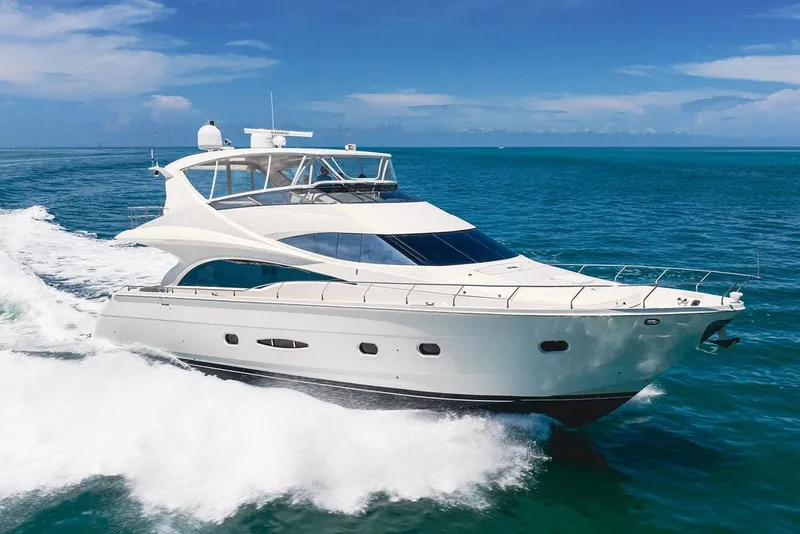 Slide: The Image of Luxurious 2005 Marquis 65 MY yacht cruising on clear blue ocean waters. - 15