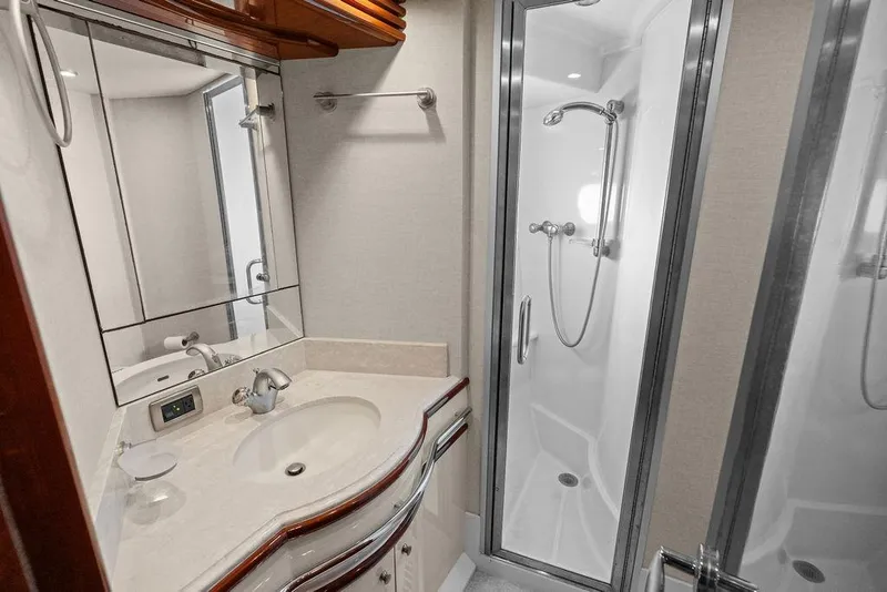 Slide: The Image of Luxurious bathroom in 2005 Marquis 65 MY yacht with modern shower and elegant sink. - 23