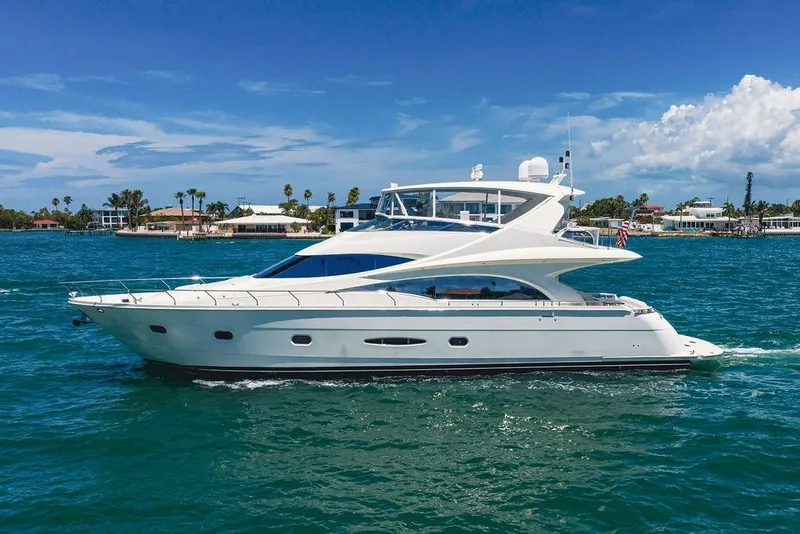 The Image of Luxury 2005 Marquis 65 MY yacht cruising on clear blue waters. - 0