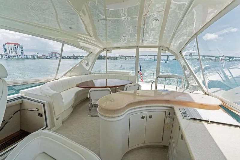 Slide: The Image of Luxurious 2005 Marquis 65 MY yacht interior with elegant seating and panoramic water views. - 64