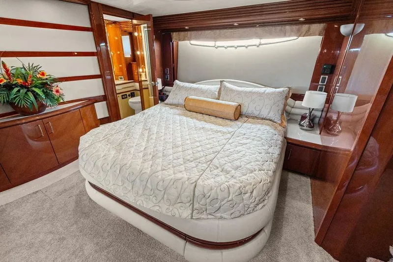 Slide: The Image of Luxurious bedroom interior of 2005 Marquis 65 MY yacht with elegant bedding and wood accents. - 28