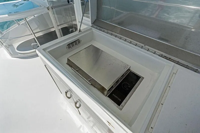 Slide: The Image of Outdoor grill on 2005 Marquis 65 MY yacht deck, featuring Kenyon cooking appliance. - 52