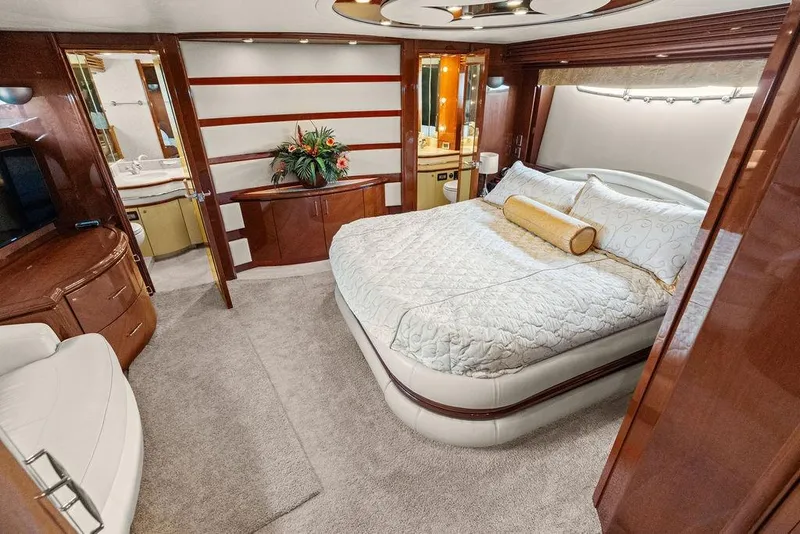 Slide: The Image of Luxurious 2005 Marquis 65 MY yacht bedroom with elegant decor and plush bedding. - 26