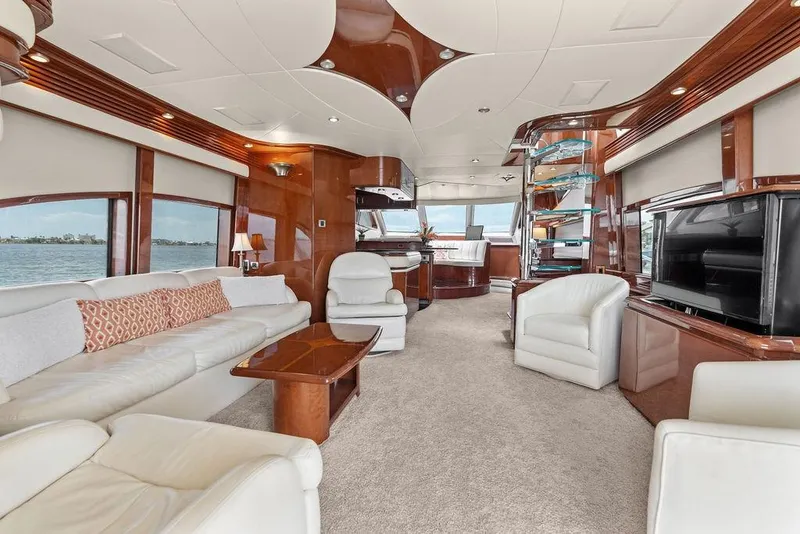 Slide: The Image of Luxurious interior of 2005 Marquis 65 MY yacht with elegant seating and panoramic windows. - 65