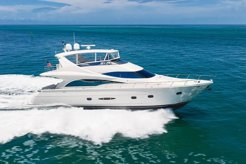 Slide: The Image of Luxury 2005 Marquis 65 MY yacht cruising on open blue sea. - 13
