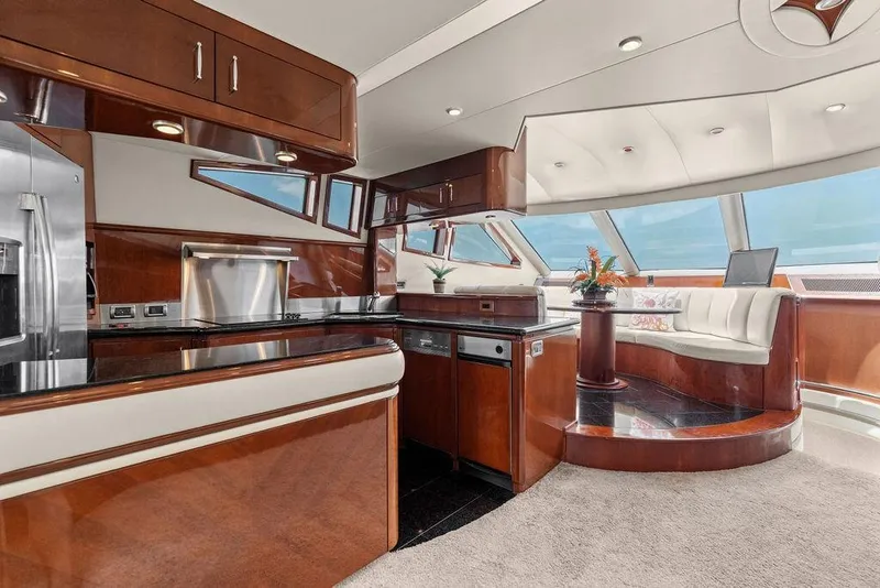 Slide: The Image of Luxurious interior of 2005 Marquis 65 MY yacht with modern kitchen and seating area. - 70