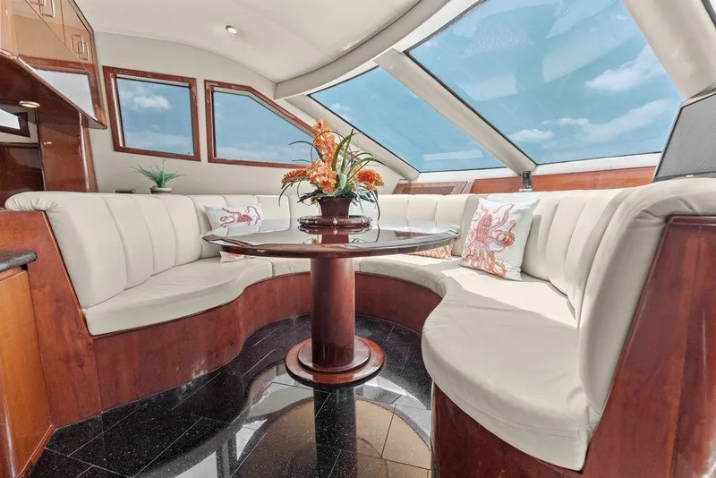 Slide: The Image of Luxurious interior of a 2005 Marquis 65 MY yacht with plush seating and elegant decor. - 73