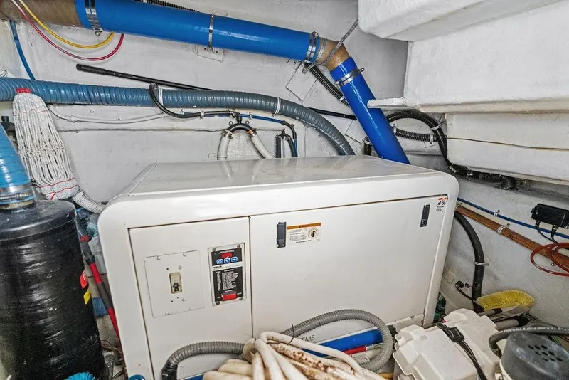 Slide: The Image of Engine room of 2005 Marquis 65 MY yacht with generator and piping. - 84