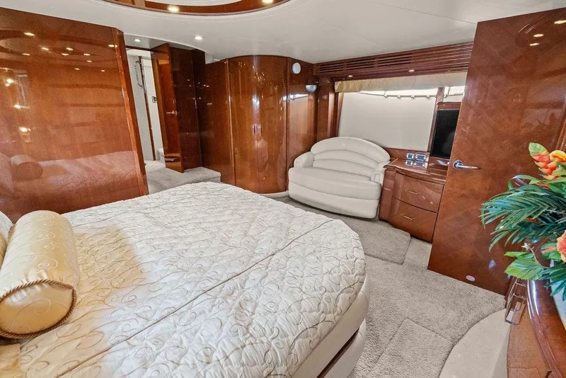 Slide: The Image of Luxurious interior of 2005 Marquis 65 MY yacht with elegant wood finishes and plush furnishings. - 27