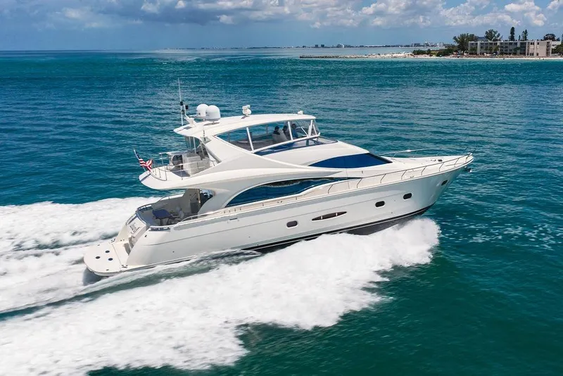 Slide: The Image of Luxurious 2005 Marquis 65 MY yacht cruising on clear blue ocean waters. - 12