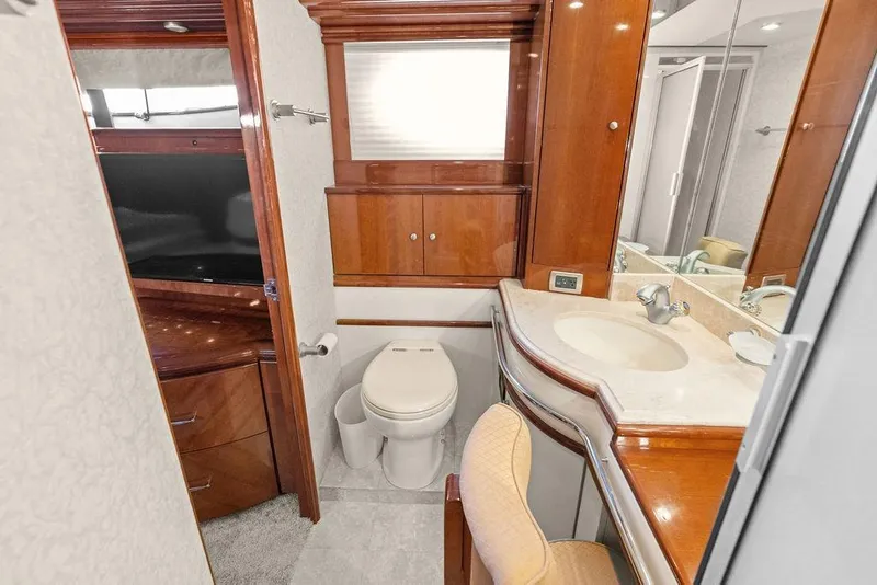 Slide: The Image of Luxurious 2005 Marquis 65 MY yacht bathroom with elegant wood cabinetry and modern fixtures. - 31