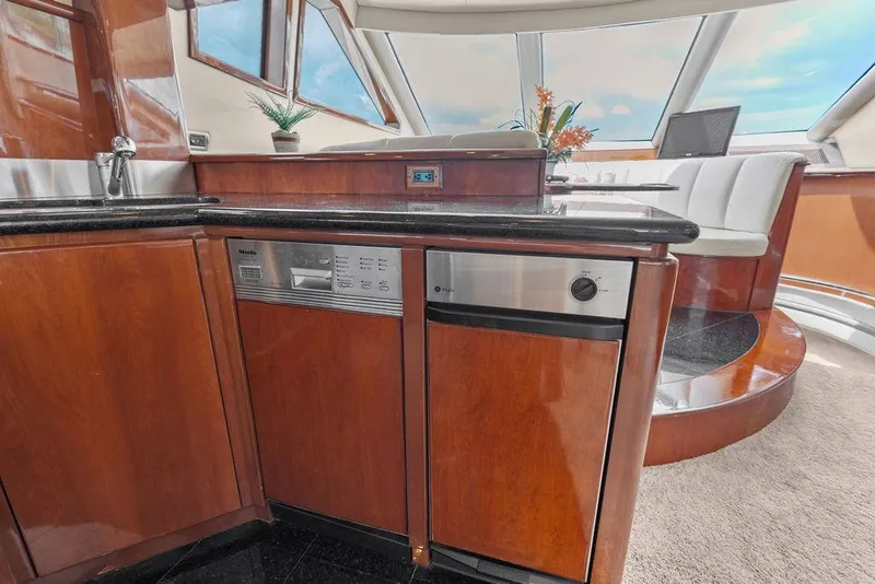 Slide: The Image of Luxurious 2005 Marquis 65 MY yacht interior with modern kitchen and seating area. - 77