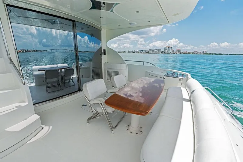 Slide: The Image of Luxurious 2005 Marquis 65 MY yacht with elegant outdoor seating and ocean view. - 39