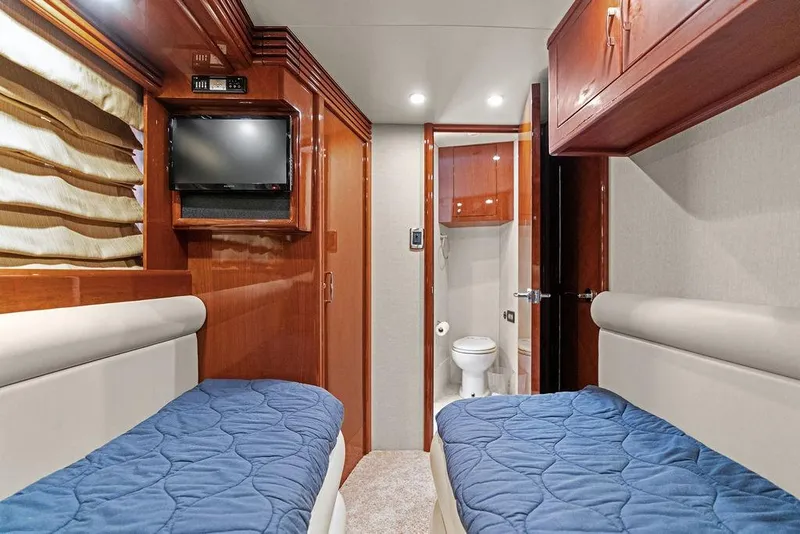 Slide: The Image of Luxurious cabin interior of 2005 Marquis 65 MY yacht with twin beds and ensuite bathroom. - 82
