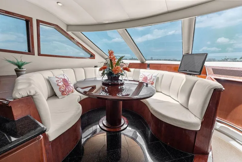 Slide: The Image of Luxurious interior of 2005 Marquis 65 MY yacht with elegant seating and panoramic windows. - 72